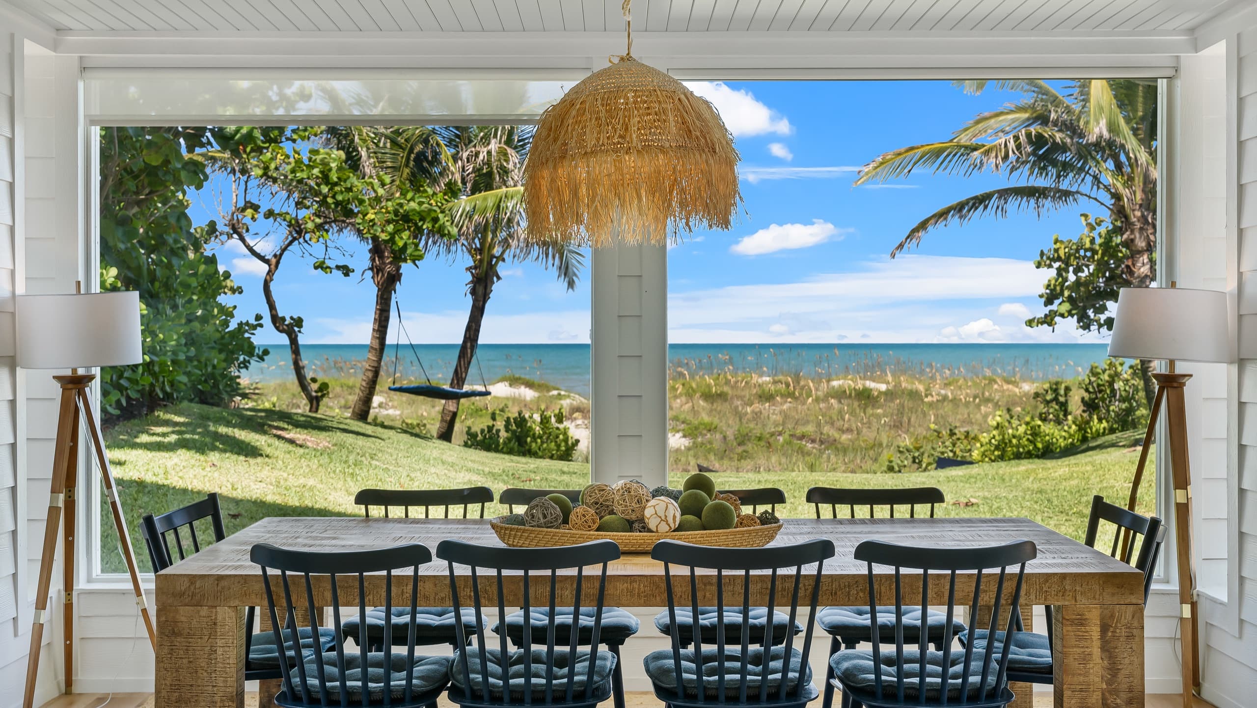 Oceanfront lifestyle shot with palms and surf